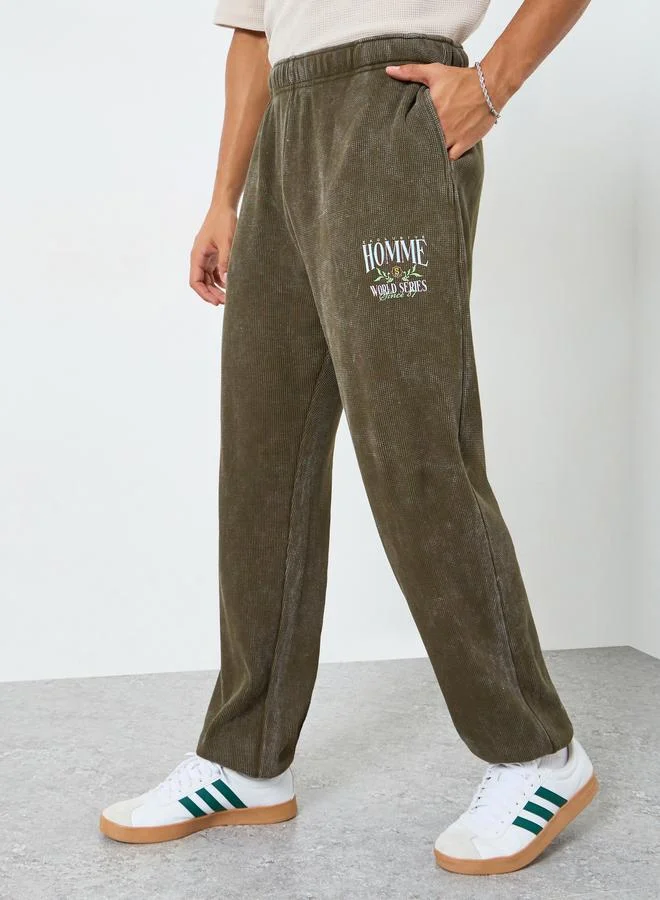 Styli Men Olive Graphic Print Relaxed Fit Joggers